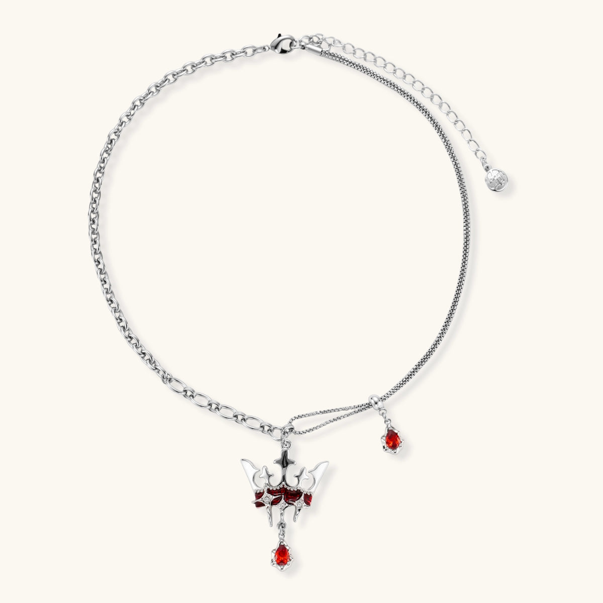 Eco-brass crown pendant necklace with red enamel details and dangling zirconia stone on chunky adjustable chain