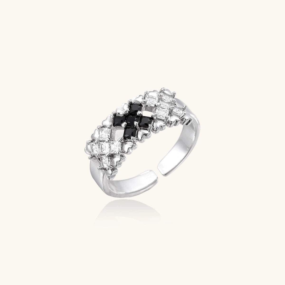 Adjustable white gold plated ring with geometric grid of black and clear zirconia stones in checkerboard pattern